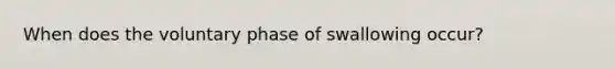 When does the voluntary phase of swallowing occur?