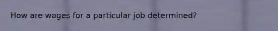 How are wages for a particular job determined?