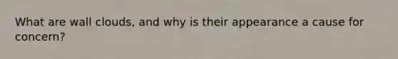 What are wall clouds, and why is their appearance a cause for concern?