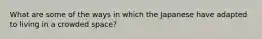 What are some of the ways in which the Japanese have adapted to living in a crowded space?