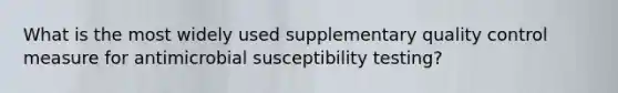 What is the most widely used supplementary quality control measure for antimicrobial susceptibility testing?