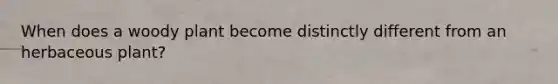 When does a woody plant become distinctly different from an herbaceous plant?