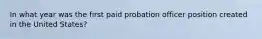 In what year was the first paid probation officer position created in the United States?