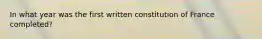 In what year was the first written constitution of France completed?