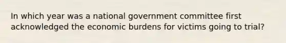 In which year was a national government committee first acknowledged the economic burdens for victims going to trial?