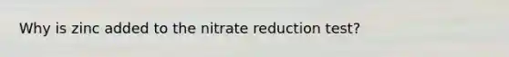Why is zinc added to the nitrate reduction test?
